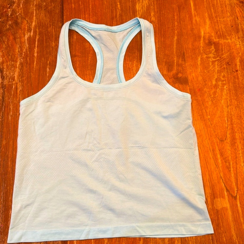 Swiftly Tech Racerback Tank Top
Waist Length, size 8
